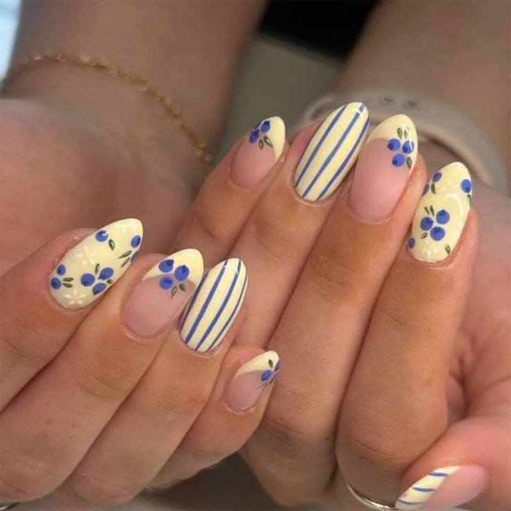 Artificial nail art with playful dots and bows Stornfield