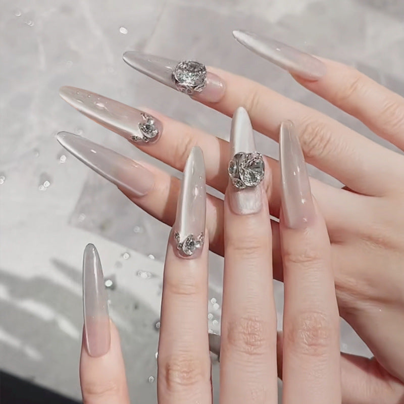 Acrylic nail set with glitter design and elegant 3D applications Stornfield