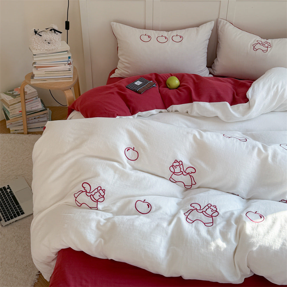 Quilted comforter with delicate bird and cloud embroidery