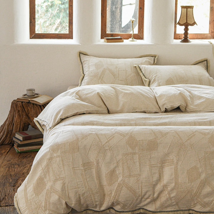 Vintage-inspired linen bedding set with subtle floral damask & ruffle