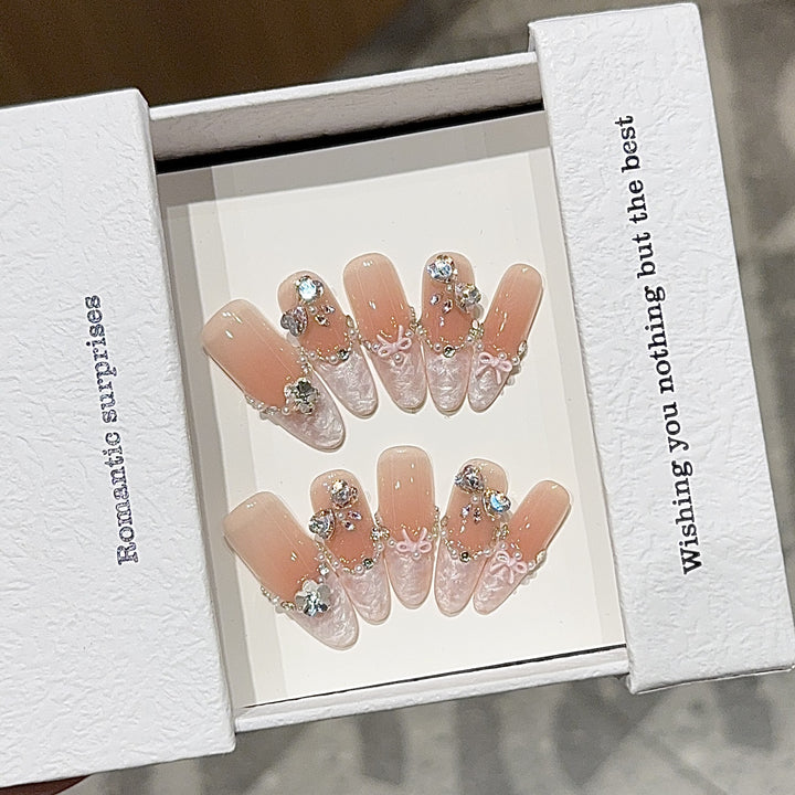 Artificial nails with romantic rhinestone details Stornfield