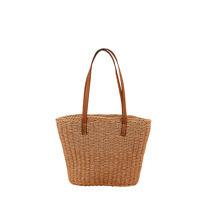 Handbag made of hand-woven natural material with sturdy leather handles Stornfield