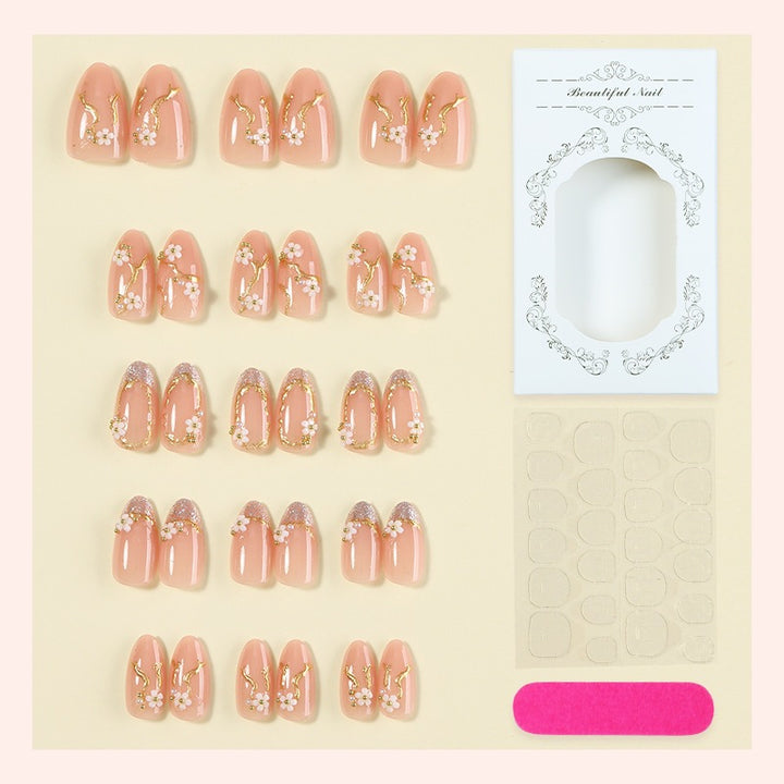 Creative nail art set with delicate flower decoration and glitter elements Stornfield
