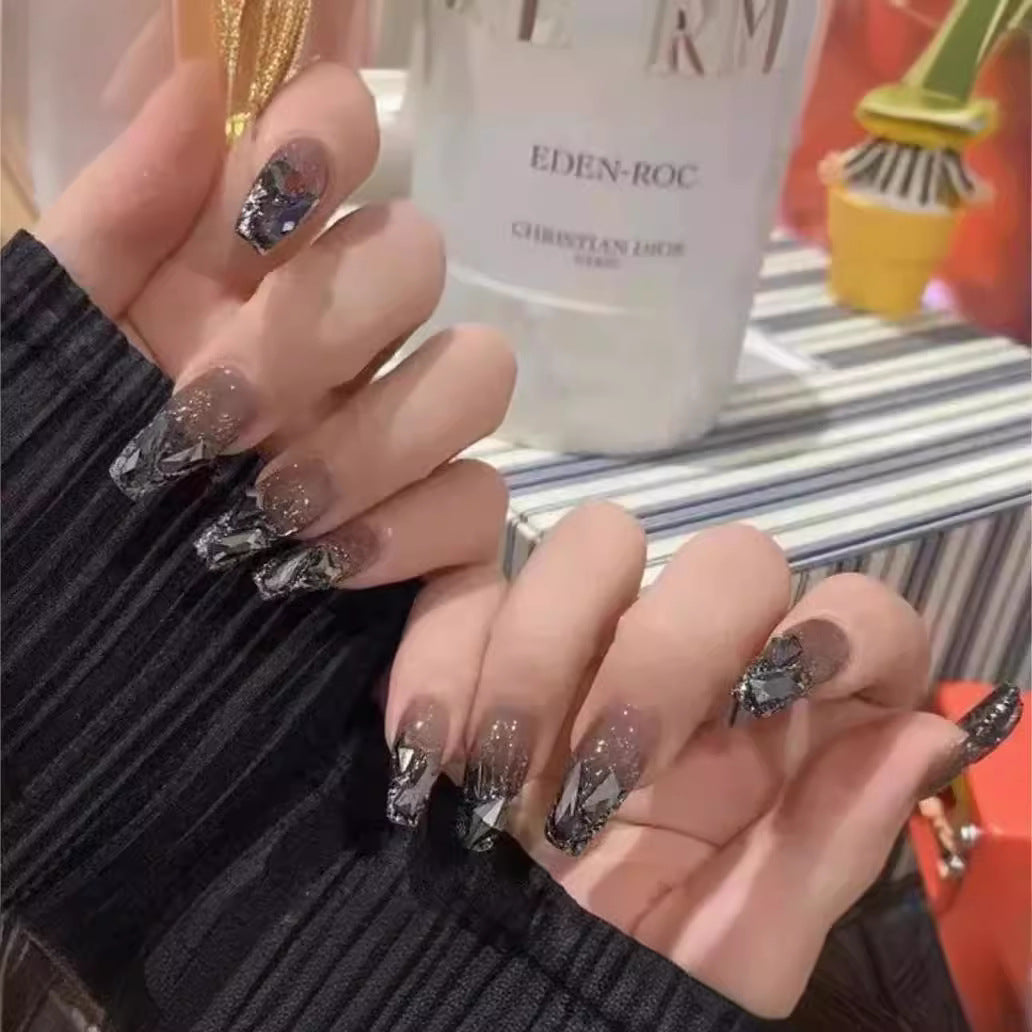 Elegant Nail Art with Glitter and Rhinestones Stornfield