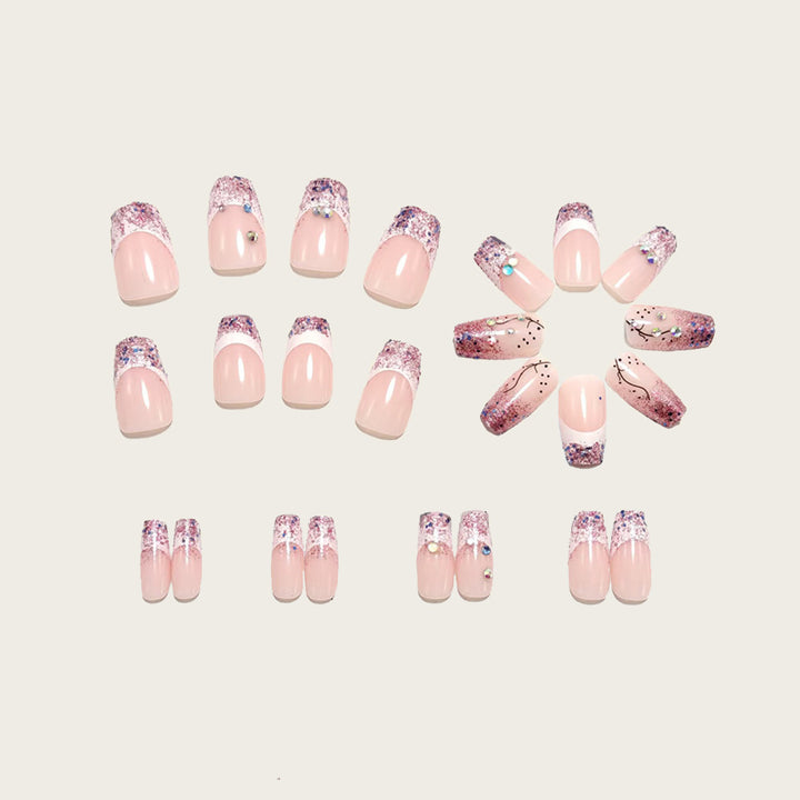 Glamorous artificial nails with glitter and rhinestone embellishments Stornfield