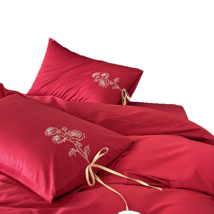 Premium cotton satin bedding set with botanical embroidery and decorative cushion ties