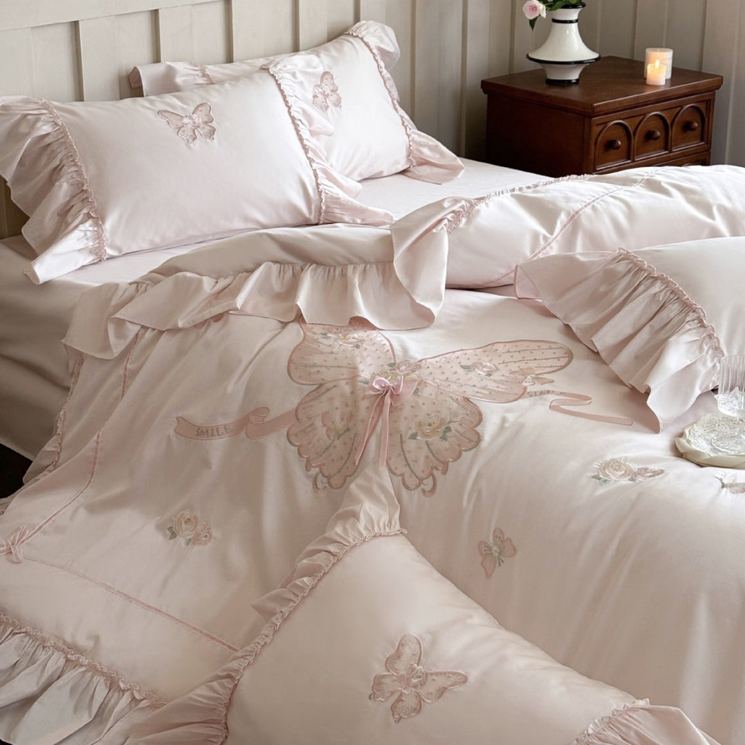Romantic ruffled bedding set with butterfly embroidery and quilted comforter