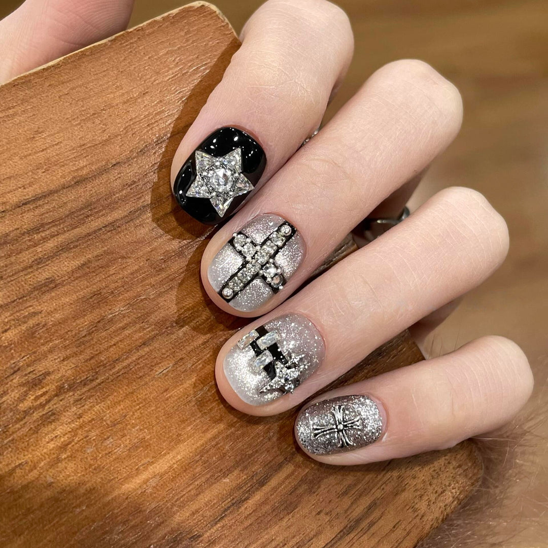 Glamorous artificial nails with rhinestone and glitter motifs Stornfield