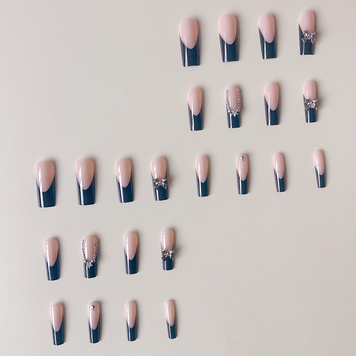 Artificial nail set with glamorous rhinestone accents and elegant 3D designs Stornfield