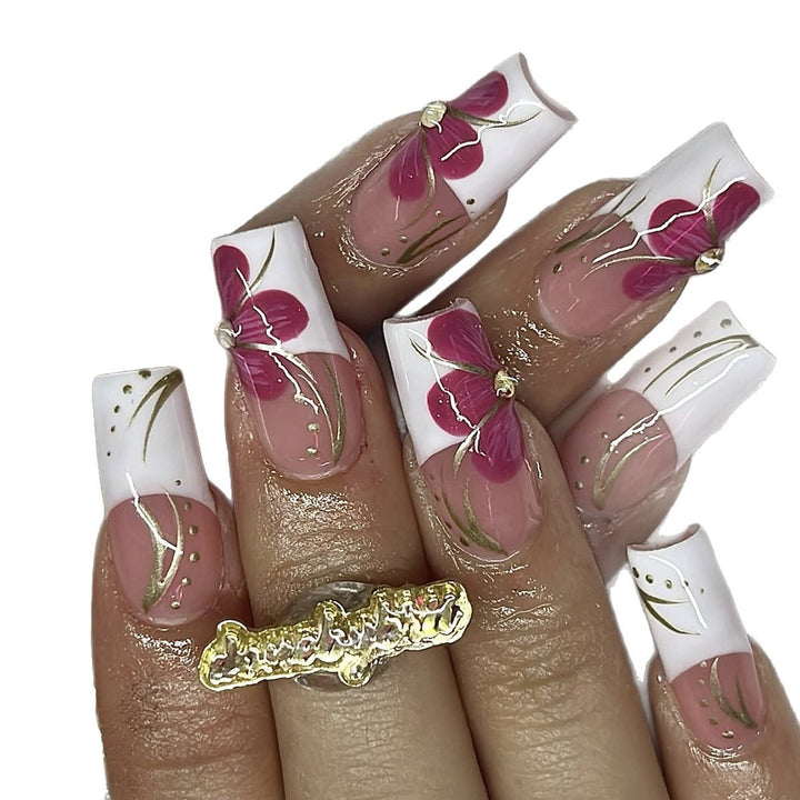 Artificial nail set with floral detail and glitter accents Stornfield