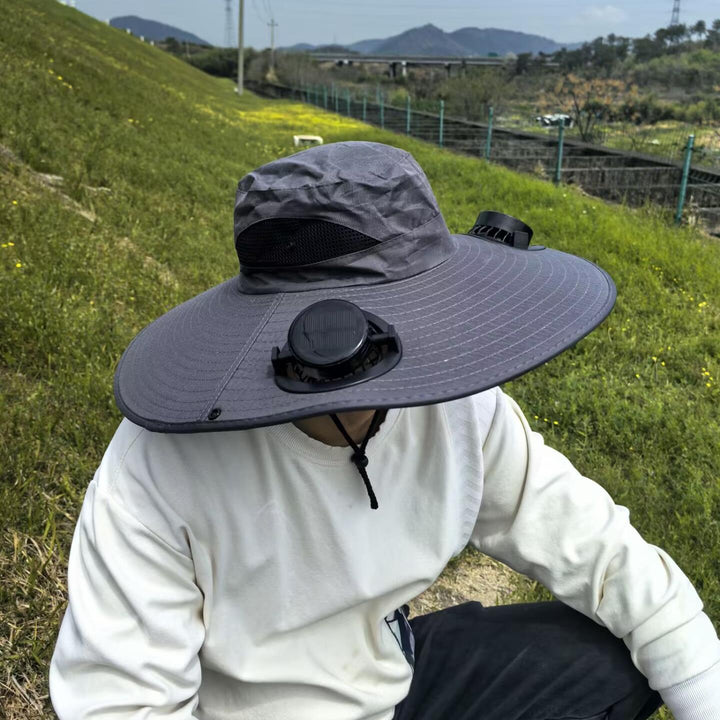 Ventilated sun hat with integrated solar fans and wide brim Stornfield