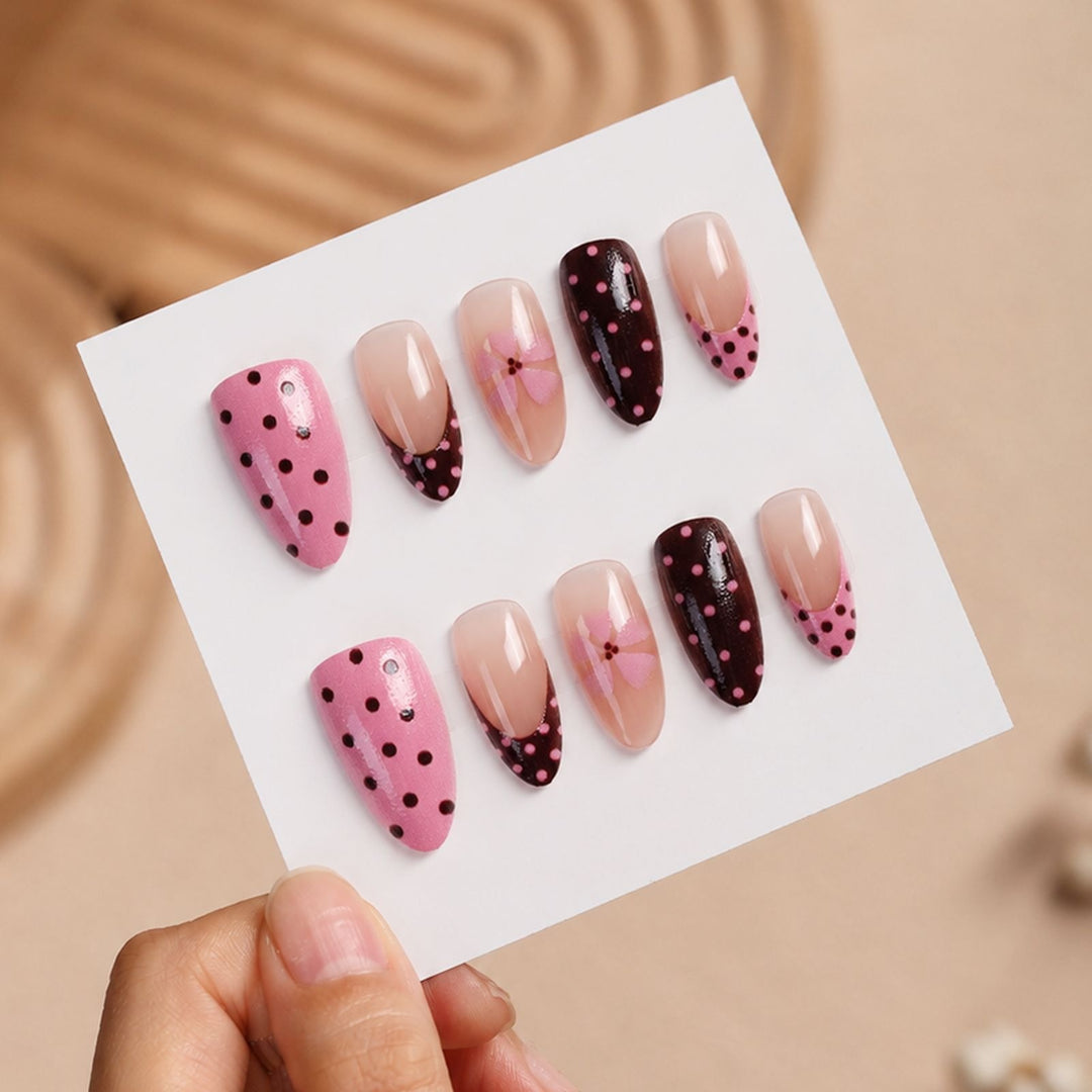 Artificial nail set with playful dots and floral accents Stornfield