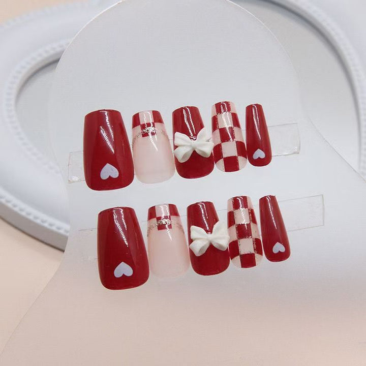Artificial nails with decorative heart and bow details Stornfield