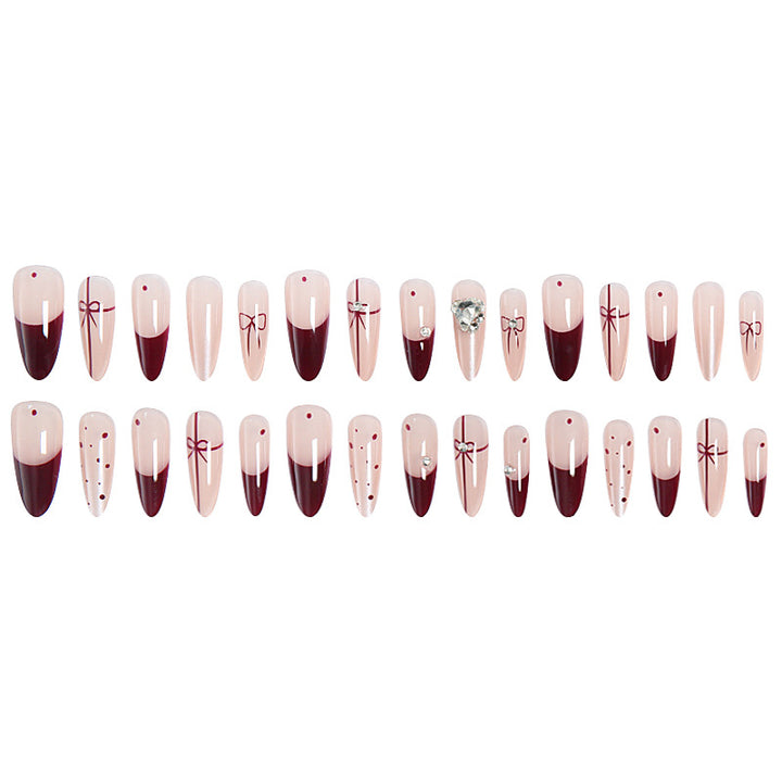Artificial nail set with elegant bow and glitter details Stornfield