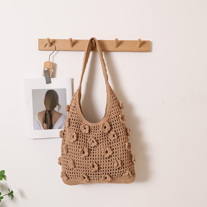 Hand-knotted shoulder bag with floral structural elements Stornfield
