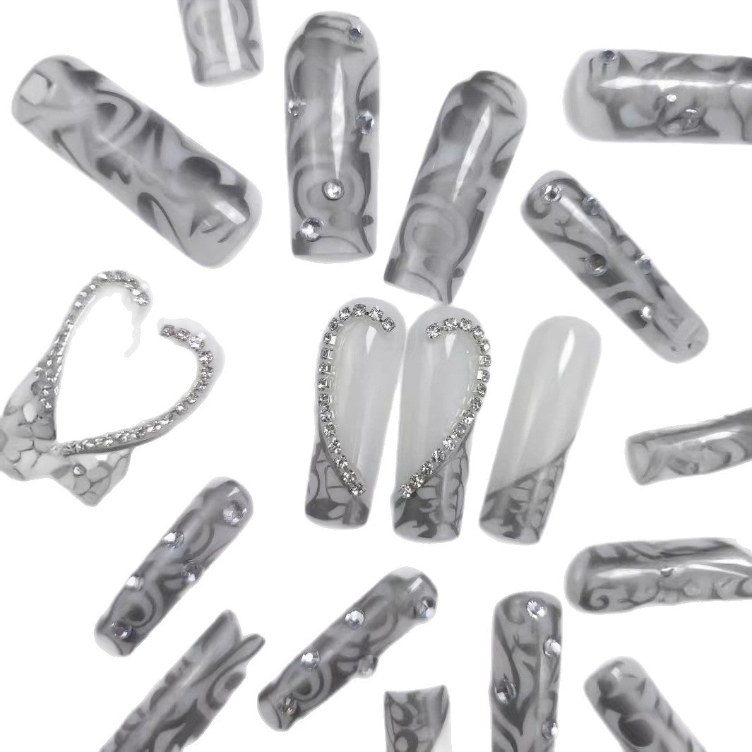 Artificial nails with elegant 3D pattern and radiant rhinestone decorations Stornfield