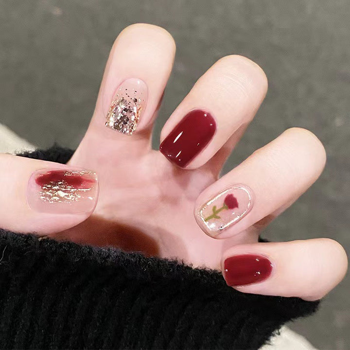Elegant nail design with floral and sparkling accents Stornfield
