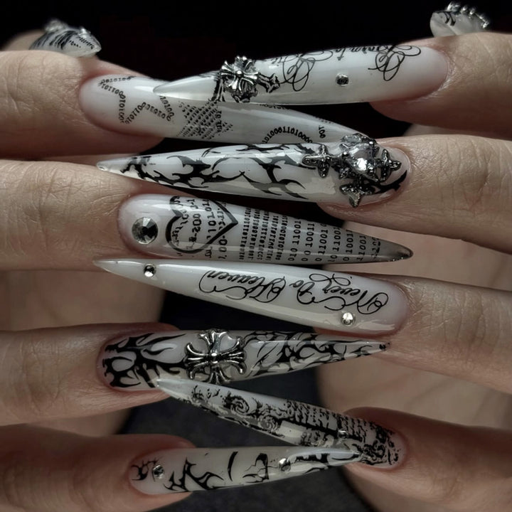 Artful stiletto nails with gothic pattern and embellishments Stornfield