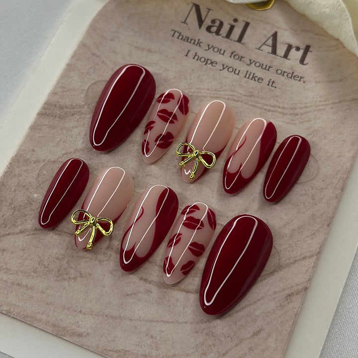 Artificial nail set with elegant bow and lip designs Stornfield