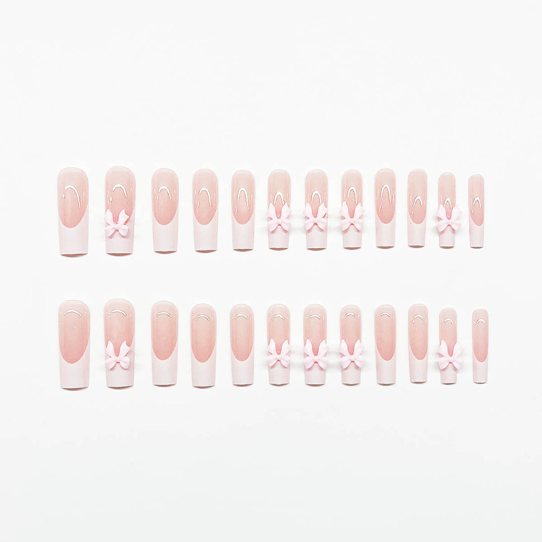 Artificial nails with playful bow design Stornfield