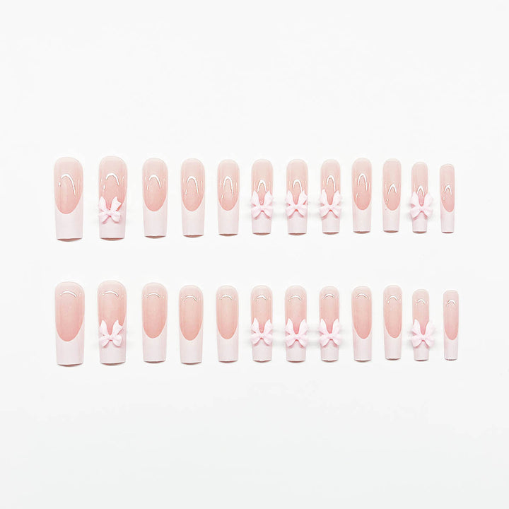 Artificial nails with playful bow design Stornfield