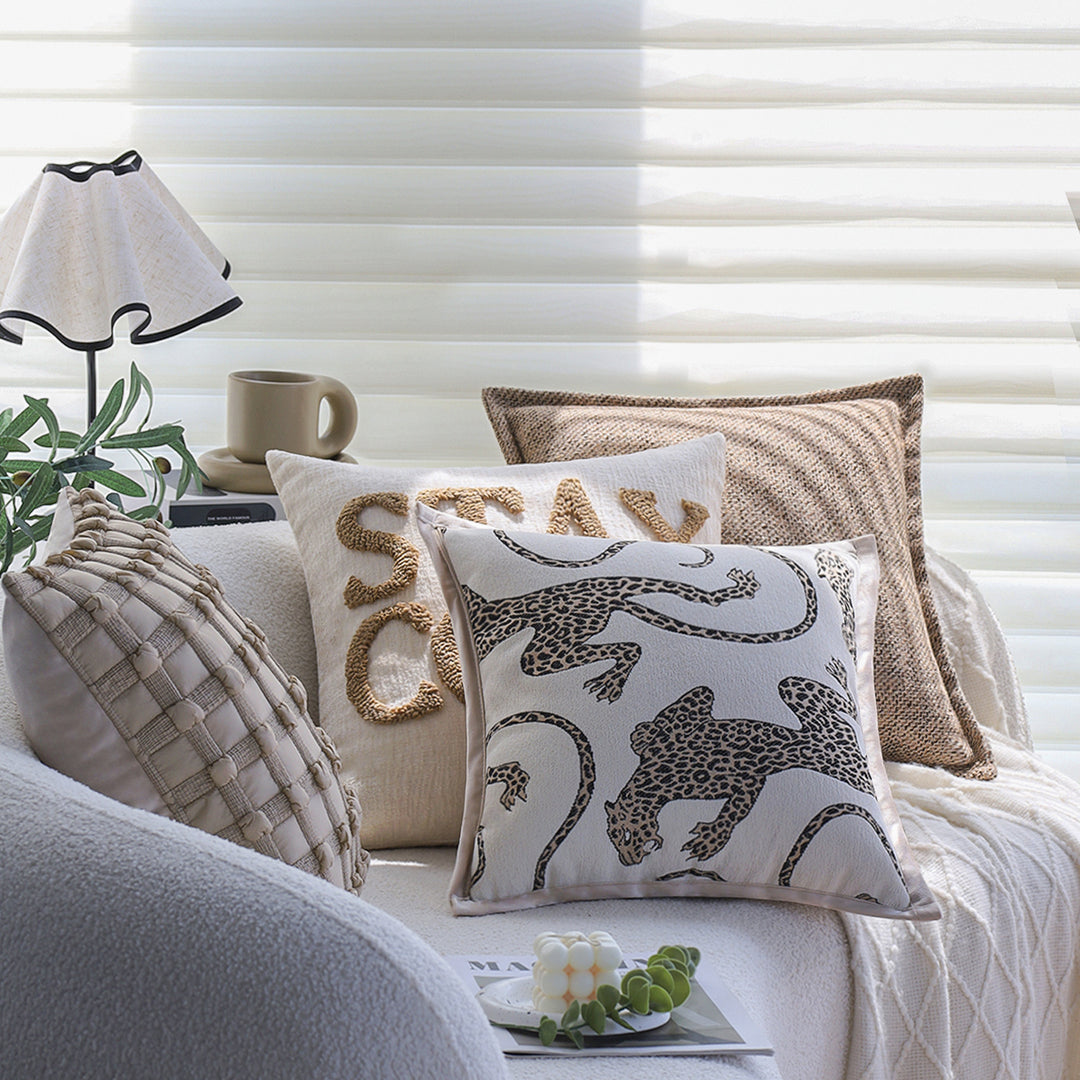 Square decorative cushion cover made of mottled bouclé weave with subtle piping Stornfield