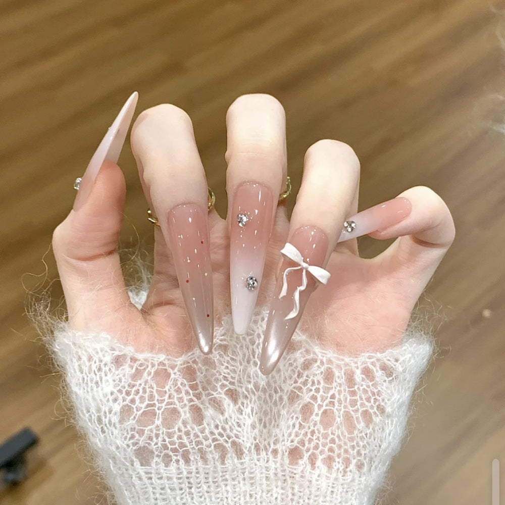 Artificial nails with elegant ombre design and delicate accents Stornfield