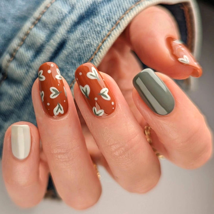 Elegant artificial nails with creative heart decorations Stornfield