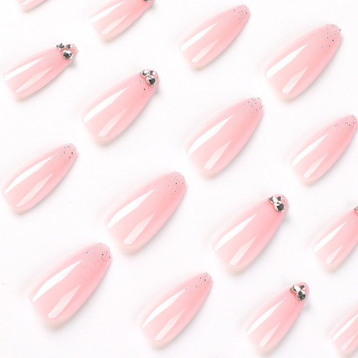 Elegant Nail Art with Glitter and Rhinestone Decorations Stornfield