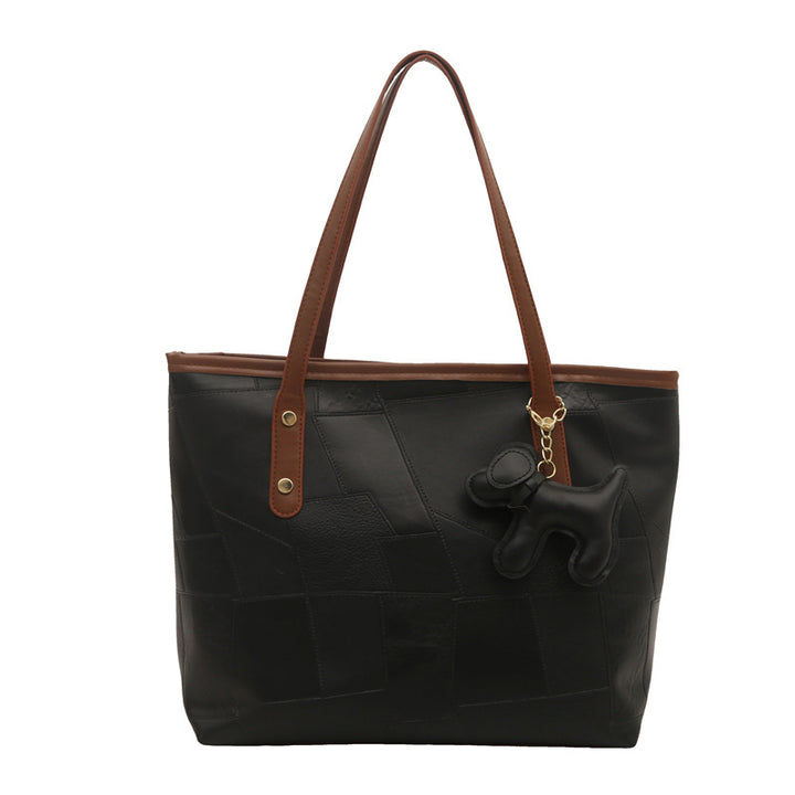 Stylish Textured Tote Bag with Decorative Charm