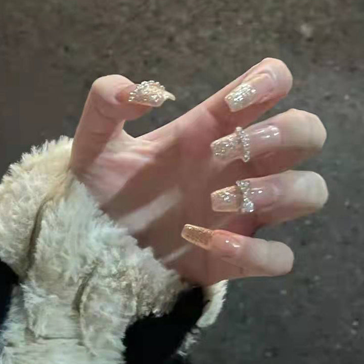 Artificial nails with glitter and heart design Stornfield