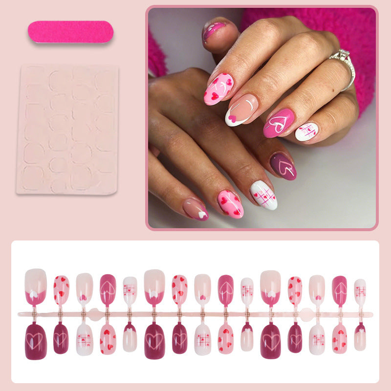 Acrylic nail set with romantic heart motif and creative patterns Stornfield