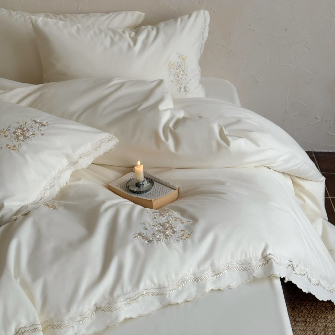 Fine cotton satin bedding set with floral relief embroidery and delicate lace edge