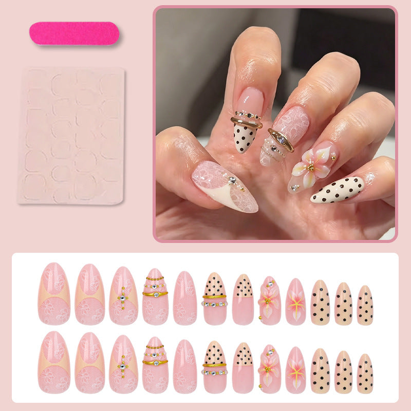Artificial nail set with delicate floral patterns and elegant accents Stornfield
