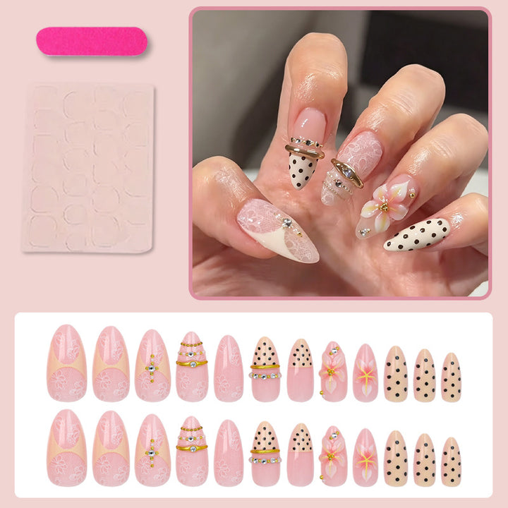 Artificial nail set with delicate floral patterns and elegant accents Stornfield