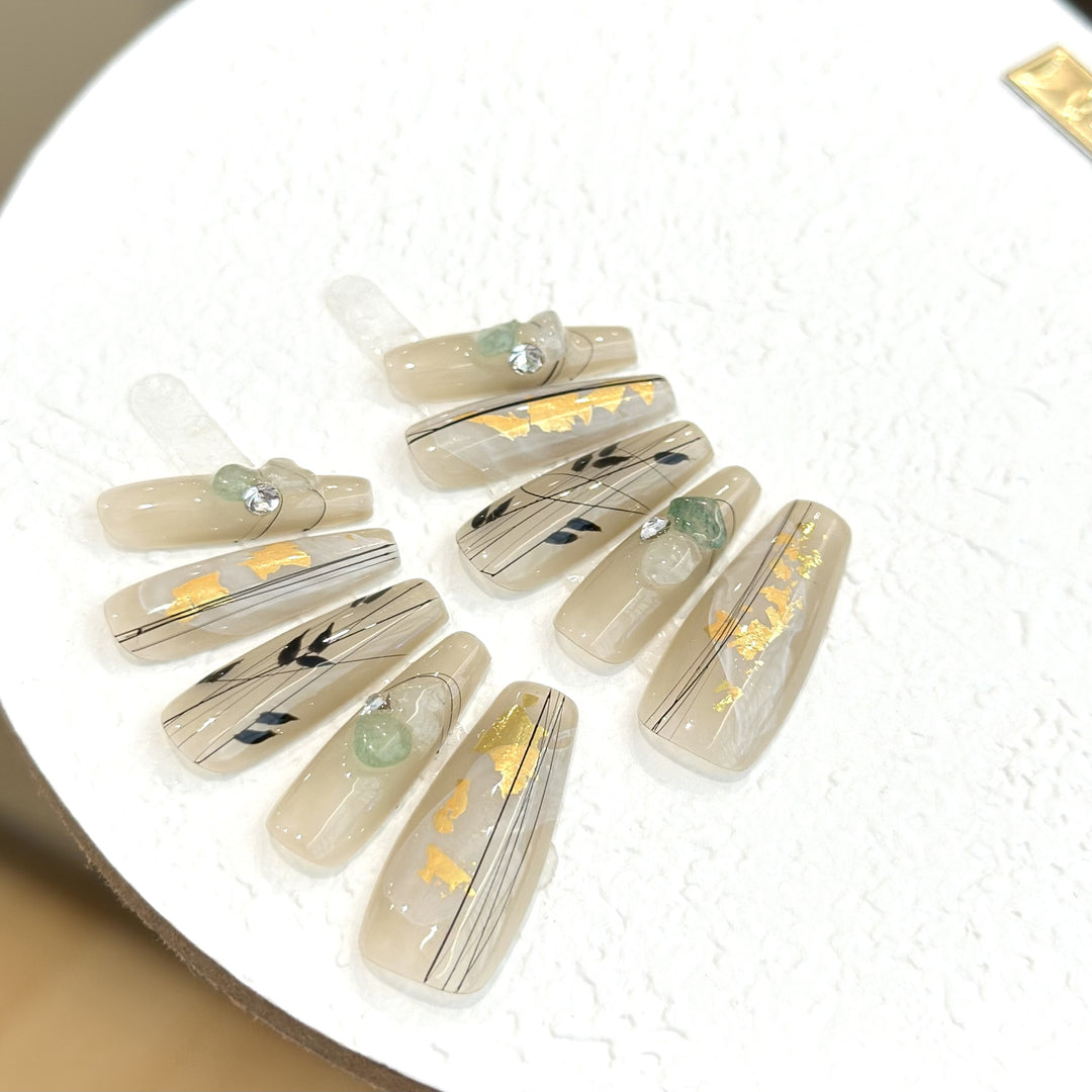 Decorative Press-On Nail Set with Artistic Accents