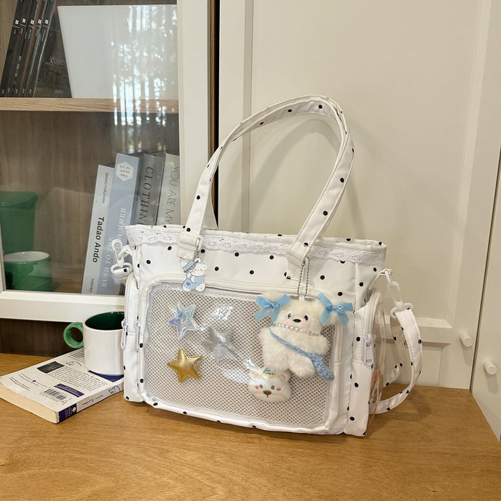 Handbag with Transparent Compartment Division and Playful Application Design Stornfield