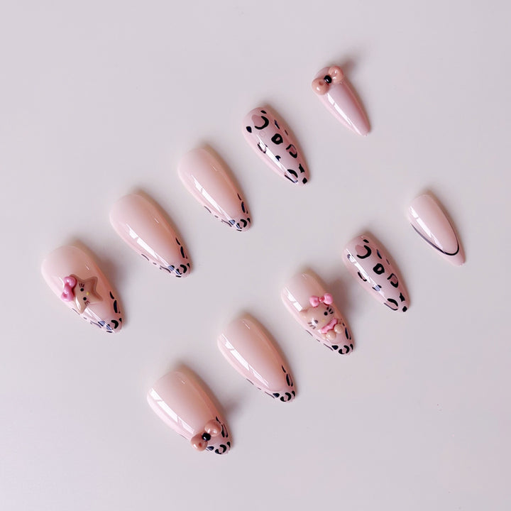 Artificial nail set with playful animal motifs and glitter accents Stornfield