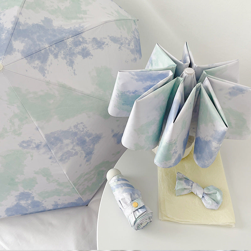 Ladies elegant folding umbrella with modern cloud pattern Stornfield