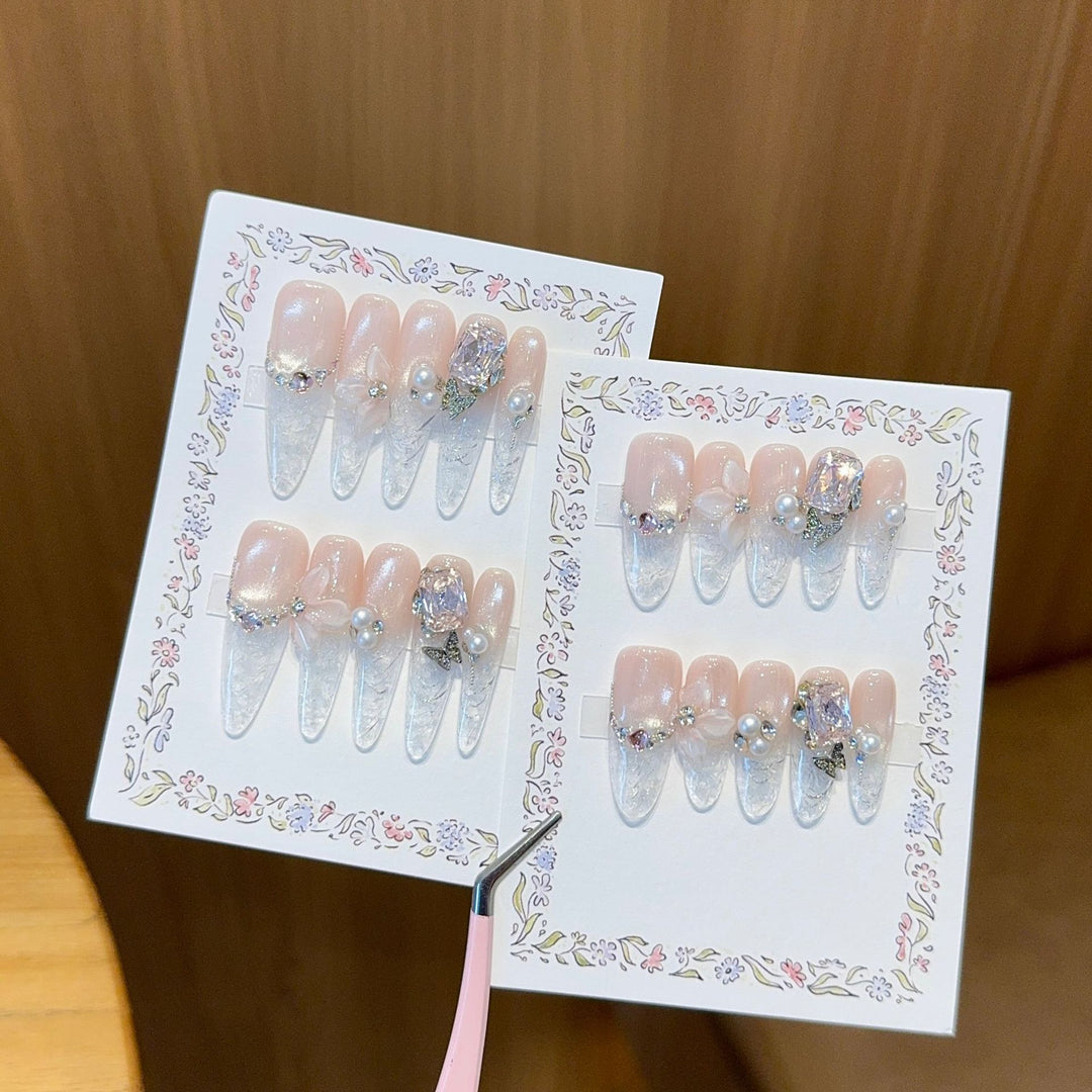 Artificial nails with delicate glitter and pearl decoration Stornfield