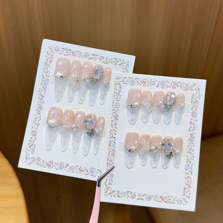 Artificial nails with delicate glitter and pearl decoration Stornfield