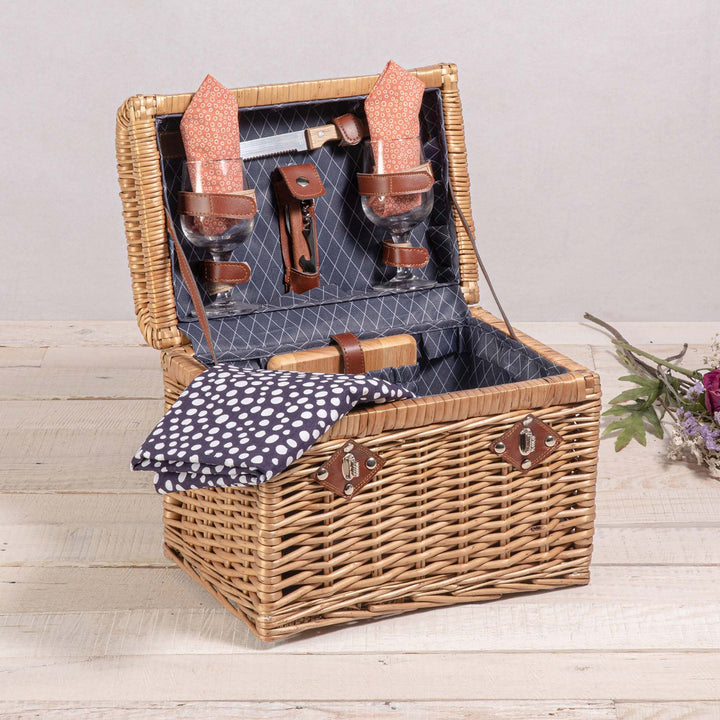 Ladies picnic basket with stylish glasses and wooden boards Stornfield