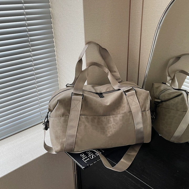 Sporty duffel bag with animal pattern and practical carrying options Stornfield