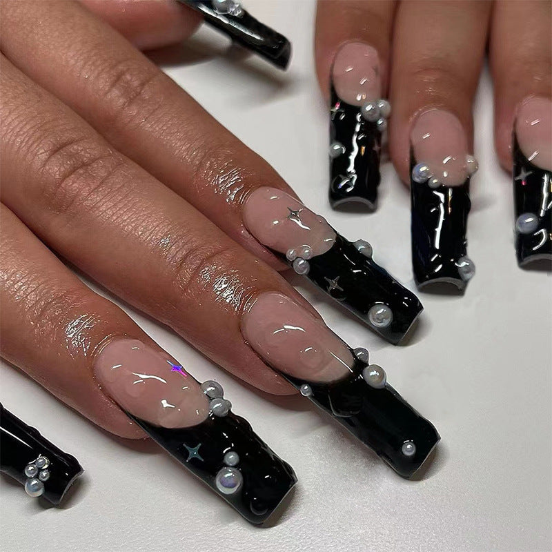 Artificial nail art with pearl and shine elements Stornfield