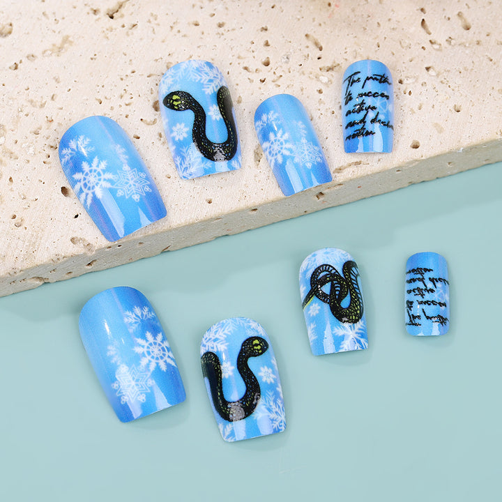 Creative art nails with snowflake and snake motif Stornfield