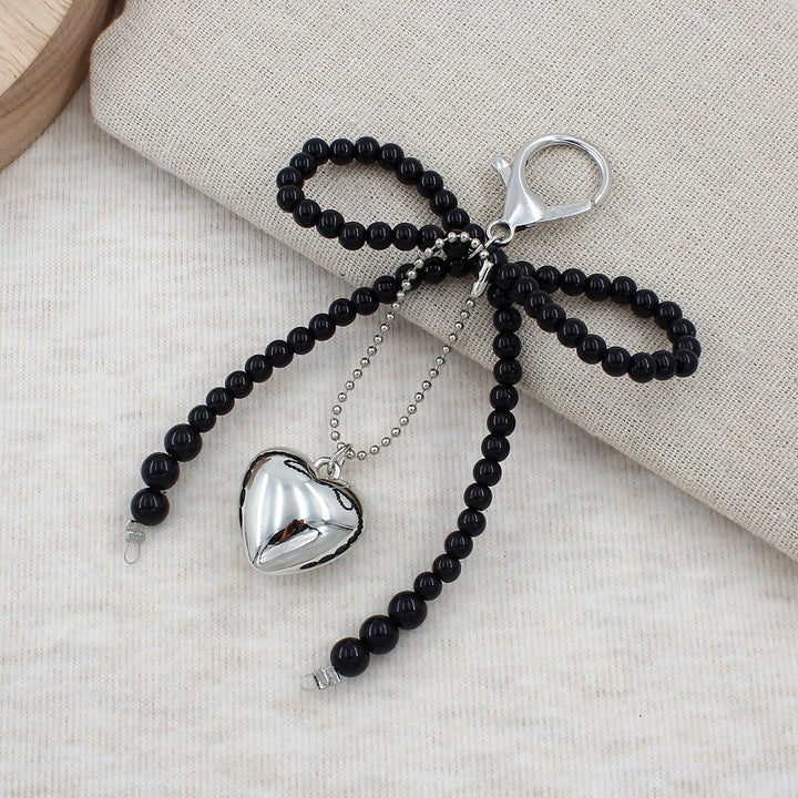 Elegant Pearl Bow Keychain Stornfield