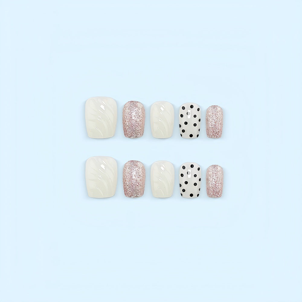 Artificial nail set with elegant glitter and dot design Stornfield