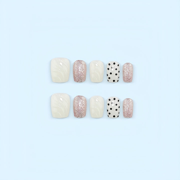Artificial nail set with elegant glitter and dot design Stornfield