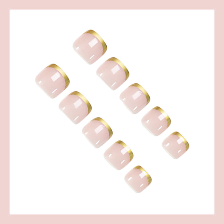 Toenail art set with elegant gold tips and delicate embellishments Stornfield