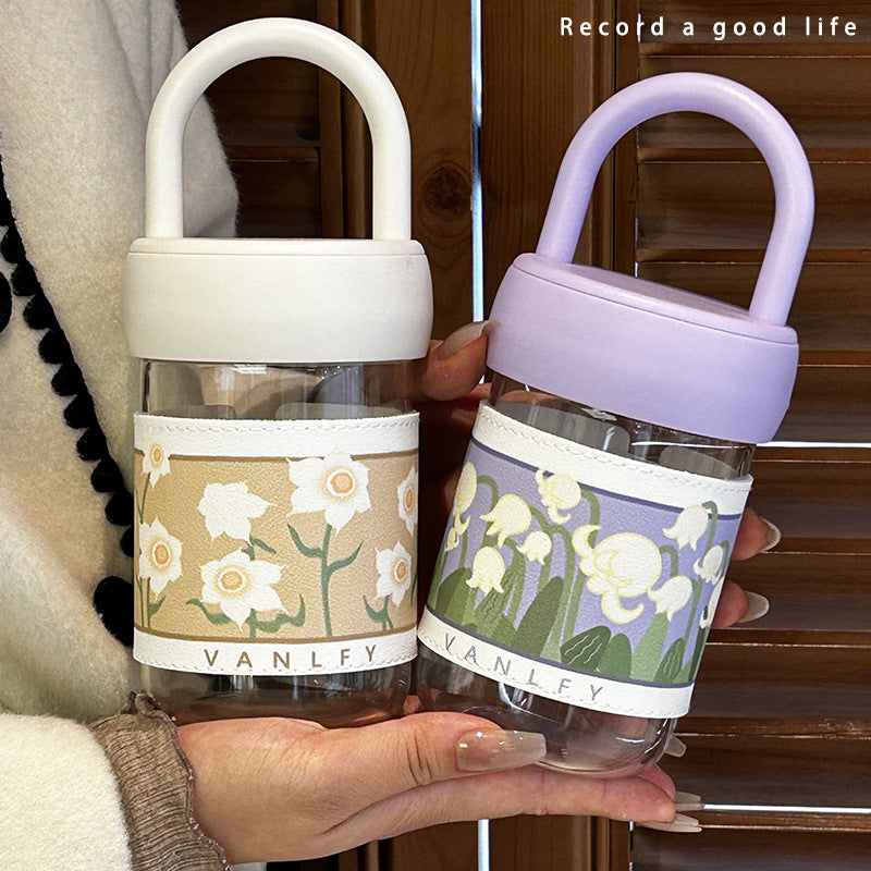 Women's insulated drinking bottle with ergonomic carrying handle and elegant flower design Stornfield